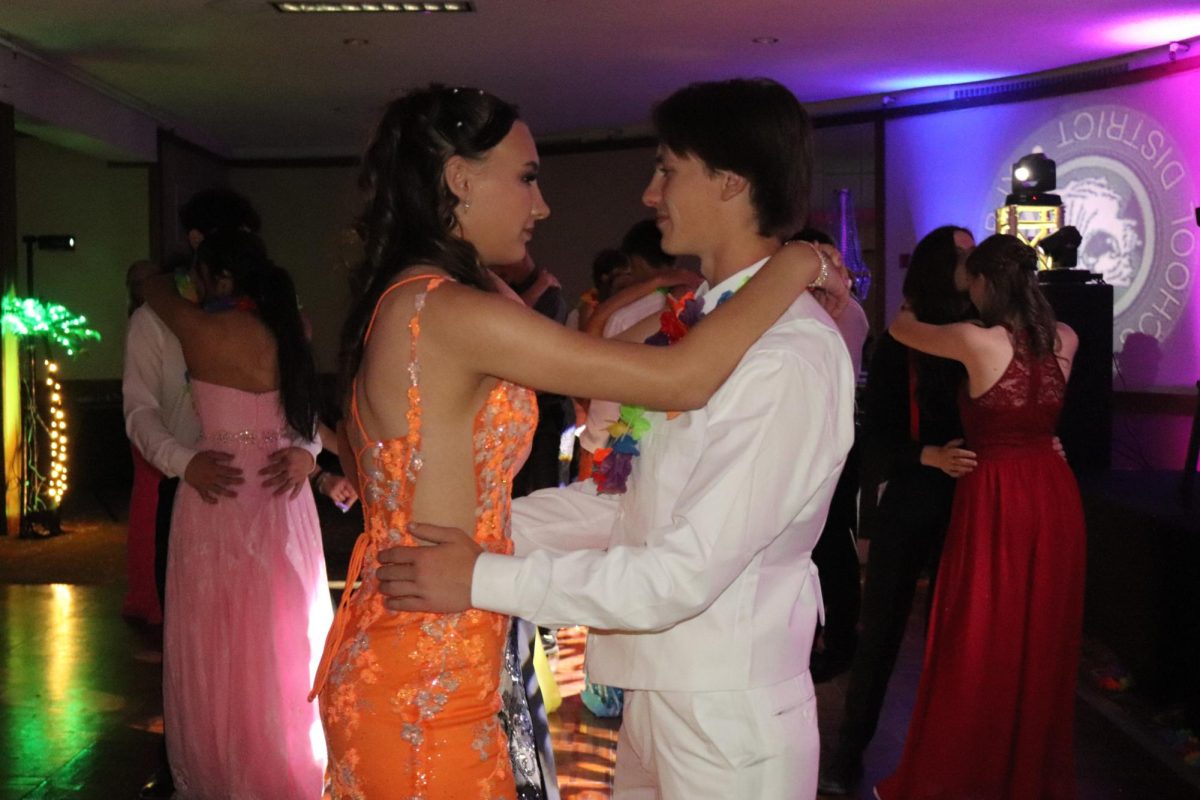 Senior Skylon Boone and date, junior Michael Garrett slow dance at prom one last time. 