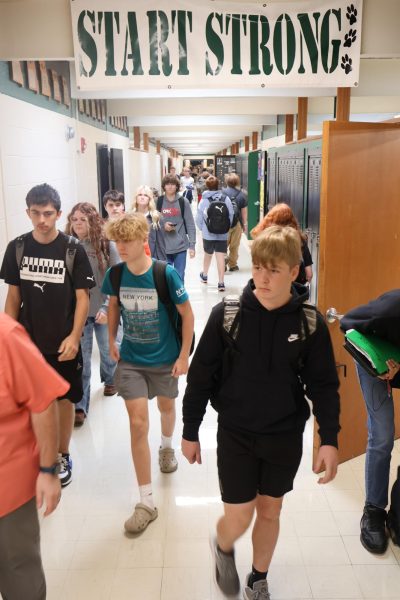 Freshmen Johrdan Decker, Jordan Anderson,and Hunter Strutten walk to fourth hour.