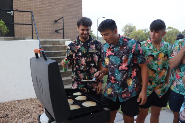 Seniors Josh Bunch, Drake Murrell and Garrett Ferguson make pancakes on the first day of school. Some seniors gathered for a “Senior Sunrise” to celebrate their last first day of school on Aug. 20.