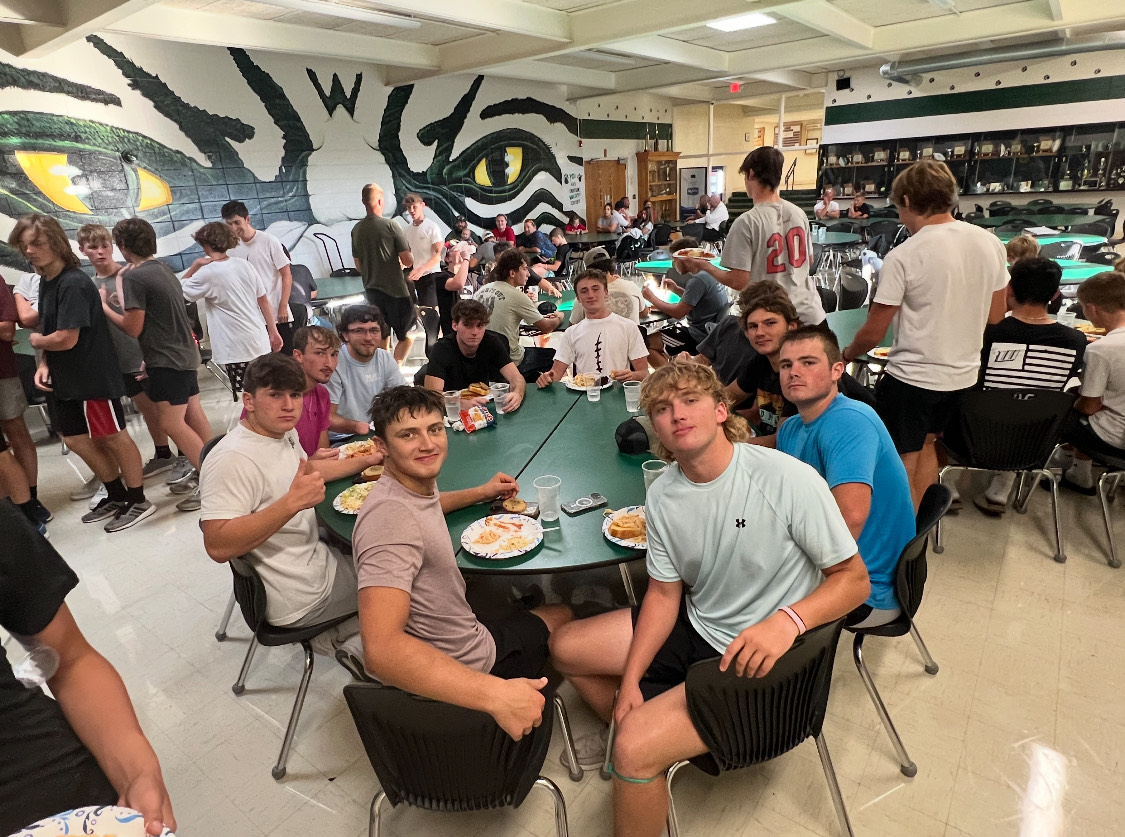  Seniors Kendall Bagley, Trent Downing, Jayce Depriest, Michael Garret, Shane Poyser, Dakota Todd, Logan Gemes, Garrett Ferguson, Drake Murrell gather together to take a photo at the pasta feed. They plan to keep the tradition going for years to comes
