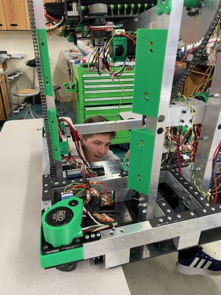 Junior JC Minks uses his skills learned in Principles of Technology to improve there robot
