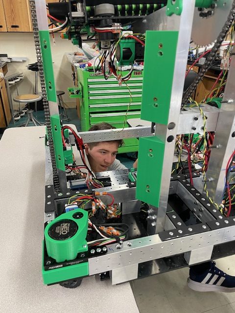 Junior JC Minks uses his skills learned in Principles of Technology to improve there robot
