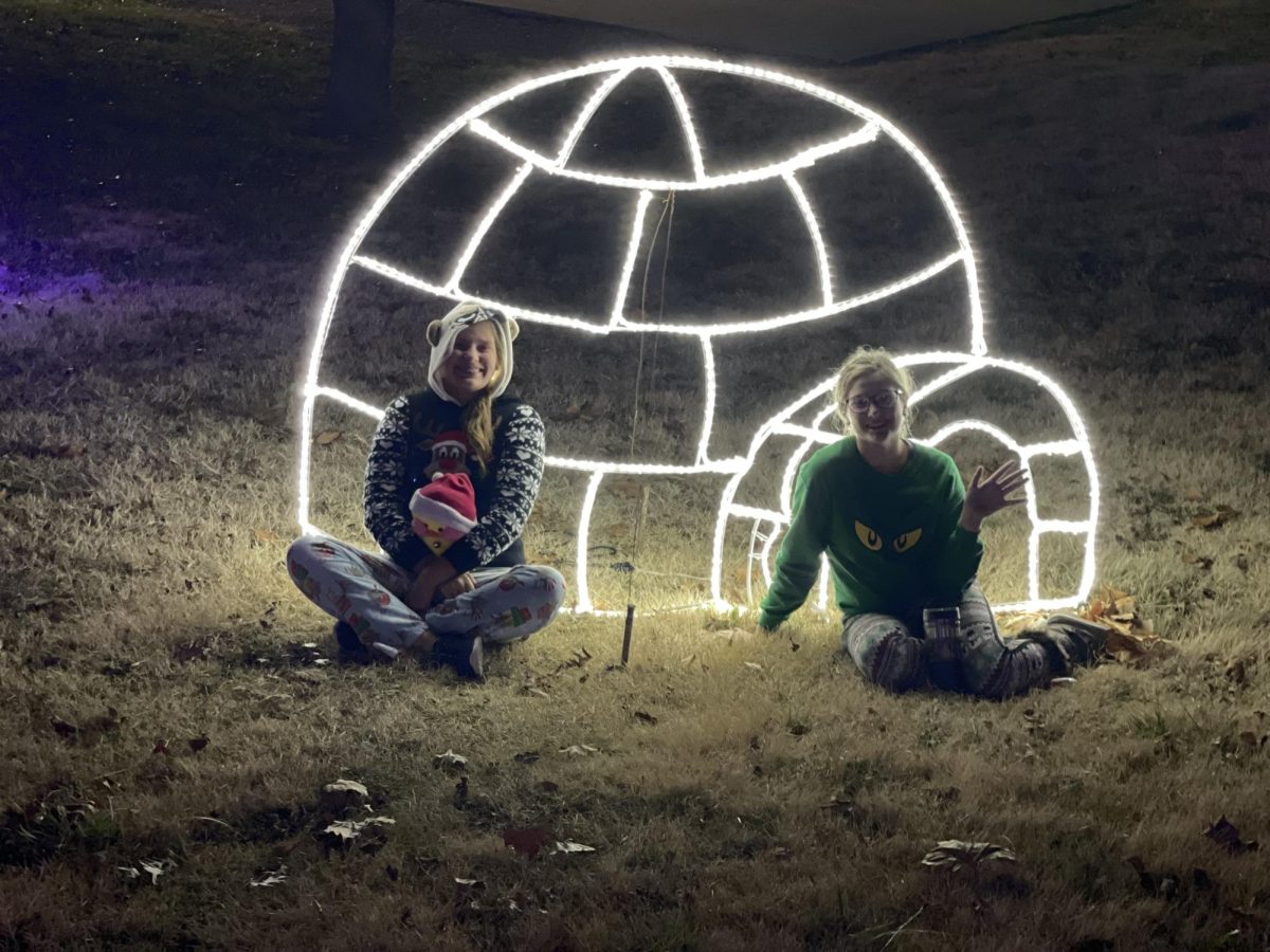 Juniors Aleah Minks and Chloey Brazel enjoyed a light display in festive outfits. 
