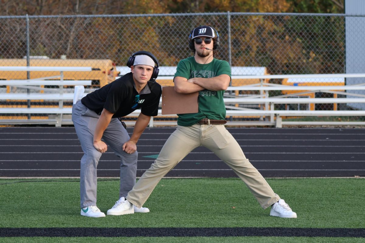 Seniors Garrett Ferguson and Dakota Todd watch as the girls execute the play. “I liked dressing up, however it was actually kind of hard to coach a group of girls with some distractions and some not knowing a lot about the sport to begin with,” Ferguson said.