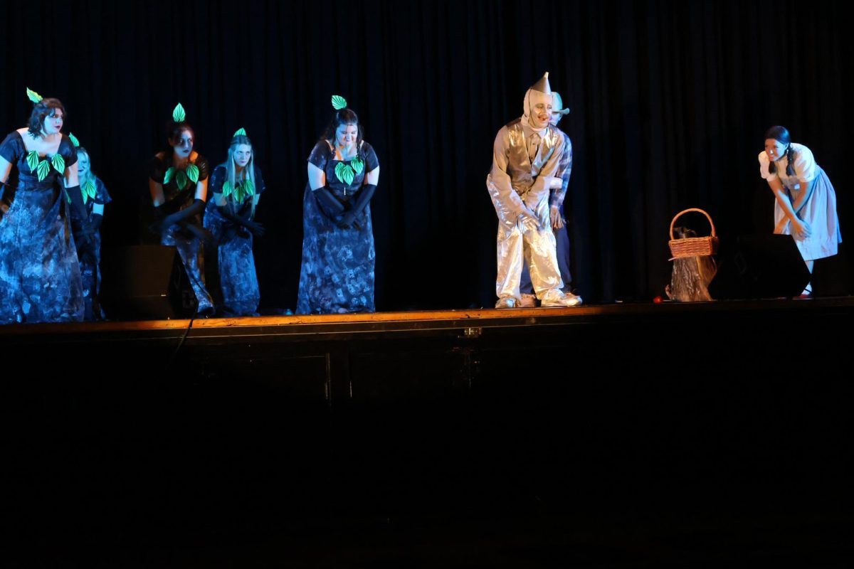 Seniors Elijah Long and Kathryn Lomax dance to the song “If I Only Had A Heart.” Long played Tin Man in the musical. 