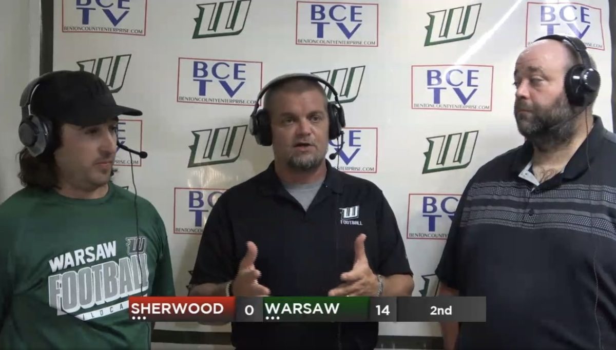 BCE TV Broadcast announcer Adam Howe speaks with announcers Drew Burdick and Matt Dove during half time of the football game against Sherwood on September 20. The Cats took the win over the Marksmen 49-7.