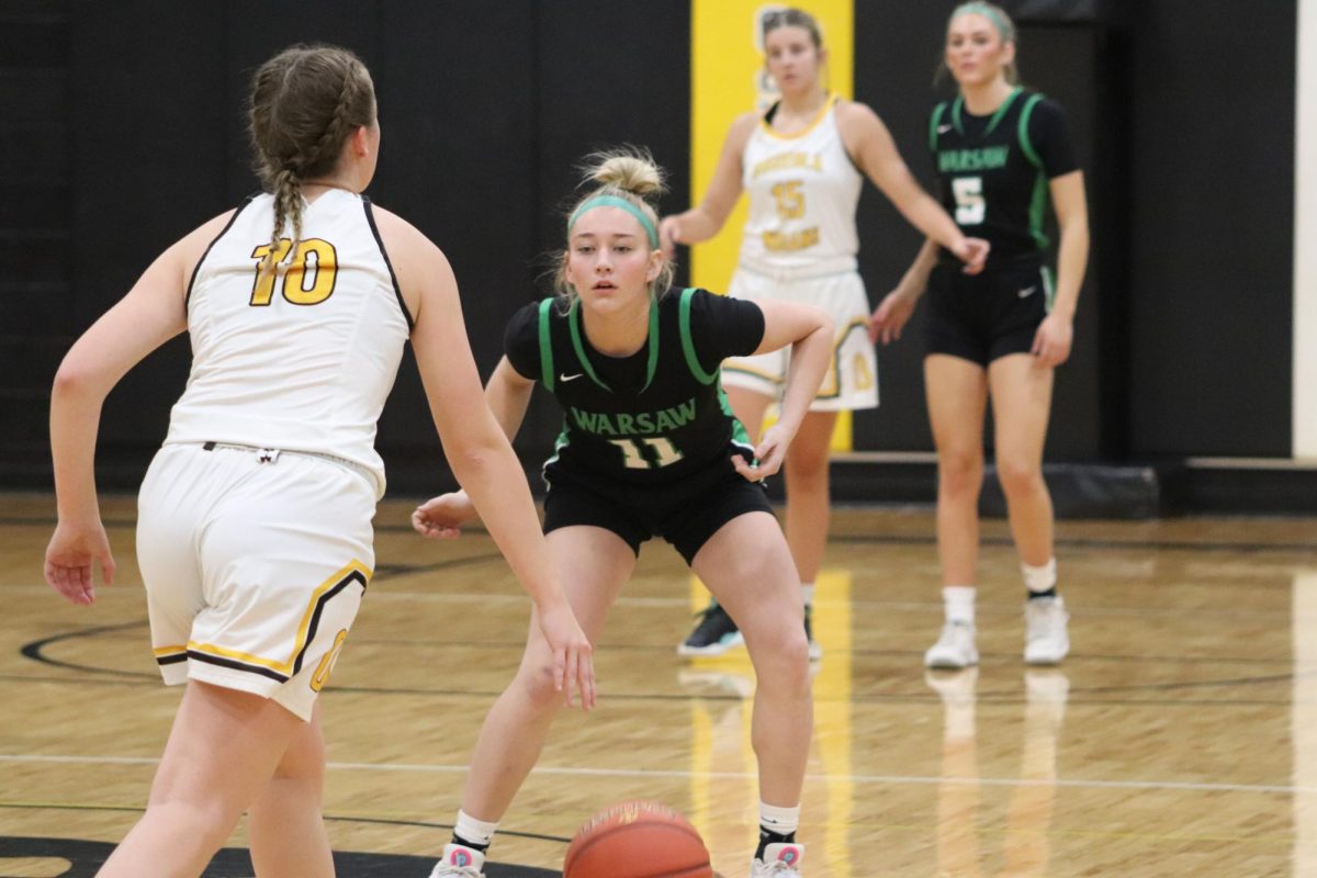 Sophomore guard Mady Reimund sits down in her stance to play defense against her opponent. The Lady Cats fell short against Osceola with a final of 36-57.