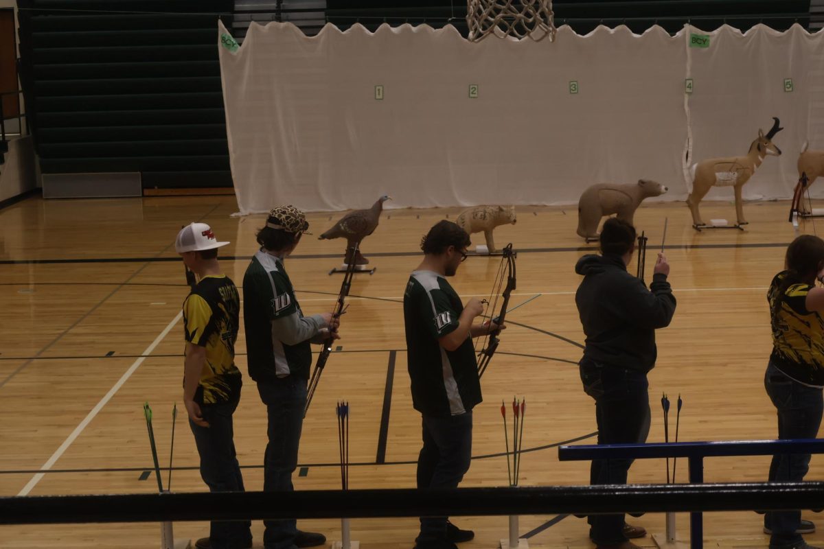 
Senior Eastynn Holt and sophomore Connor Hockett prepare to shoot for 3-D at their home tournament on Feb. 1. They both qualified for state.

