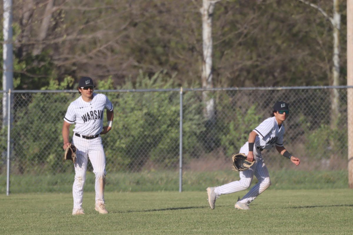 Some students share a new year goal relating to their sport, like juniors Brayden Henderson’s (below, left) goal to be in shape for track season,  Naomi Yoder’s (below) wrestling training, and senior Bradley Watson’s (left) goal to help his team win the district tournament in baseball.