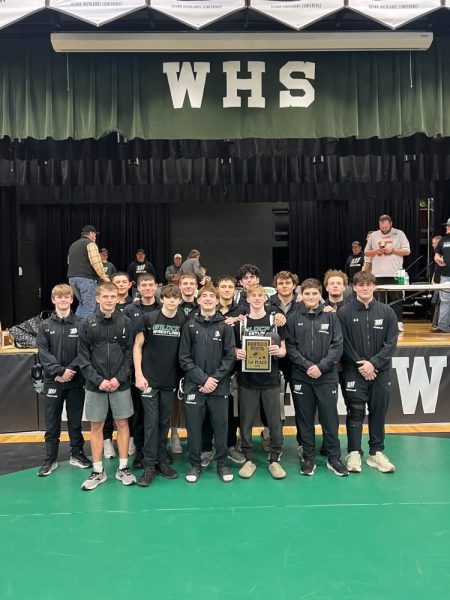 The boys wrestling team captured a first place trophy while competing at the home Warsaw Tournament. “I enjoy the atmosphere that the Warsaw Tournament brings to the community, and the support that is shown,” senior Drake Murrell said. 