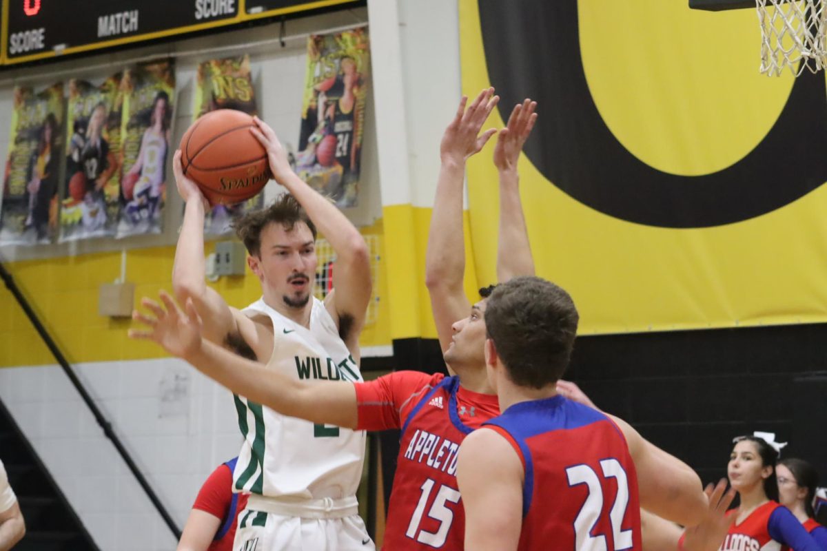 Senior/forward guard Logan Gemes making a pass to a team mate during the Osceola tournament.