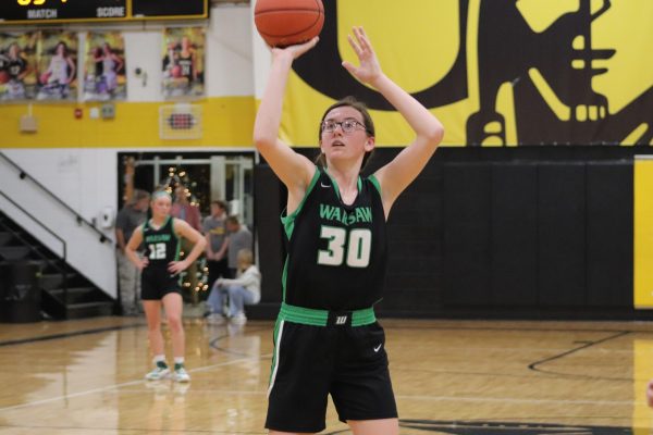 Sophomore Jenna Gerken shoots a free-thow after being foulded during the Osceola tournamnet. The ladycats were playing against Climax Springs.