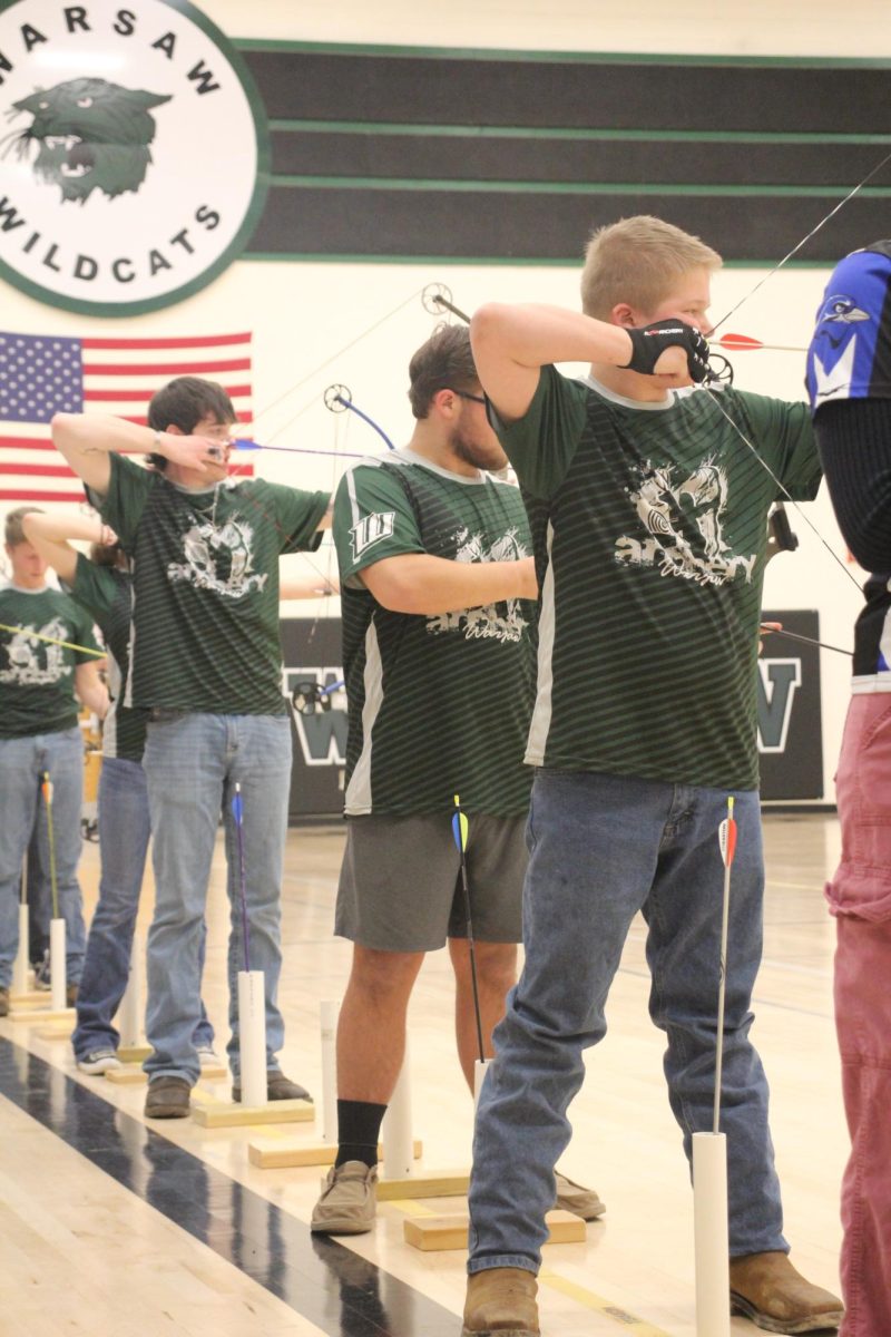 Senior Eastynn Holt, sophomore Connor Hockett, and freshman Cayden Hockett shoot in the last tournament of the season before heading to state. Only two of the archers made it to state, Connor Hockett and Holt.