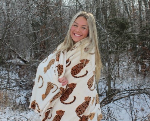 On Jan. 9 sophomore Maylee Slavens poses in the snow during a snow day. “I enjoy taking Instagram pictures in the snow,” Slavens said.