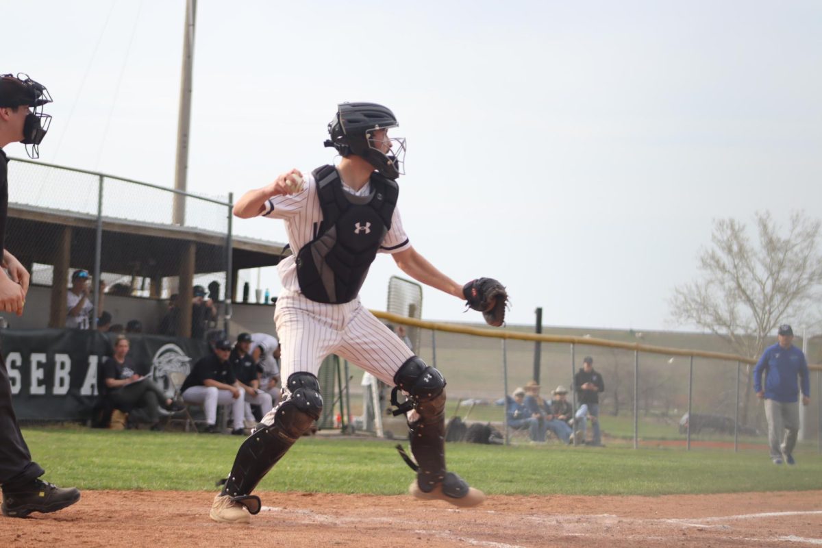 Senior catcher, Logan Gemes, throws the ball to second baseto avoid a base being stolen by a Holden Eagle. Gemes was successful on the throw, causing an out for the Eagles.