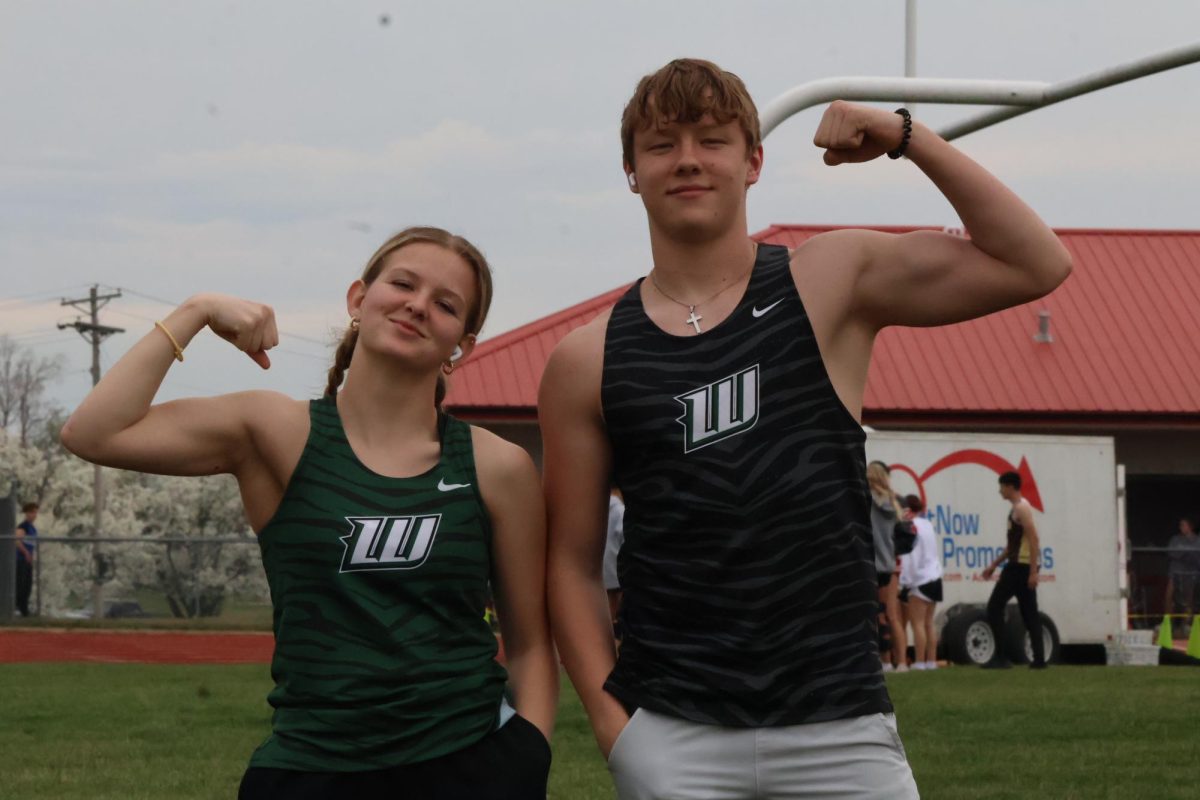 Seniors Alysia Yoder and Mason Anderson posing for a picture at the Butler meet on March 27th.