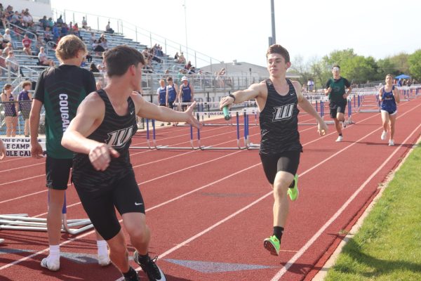 Senior Jaxson Deckard and junior Noah Siebert in the hand off at Cole Camp meet on April 23rd. 