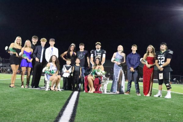 The Homecoming court celebrates after coronation. They included (front row) junior princess Sarah Miller, ? and Sawyer Hetherington, senior queen Hailey Ferguson; (back row) juiniors Maylee Slavens, Mady Reimund, Roman Reser, Brendon Caylor, prince Levi Bilderback, 2024 queen Tatum Bohl, 2024 King Garrett Ferguson, king Josh Harvath, seniors Naomi Yoder, Brayden Henderson, Sadie Chapman and Urijah Phillips.