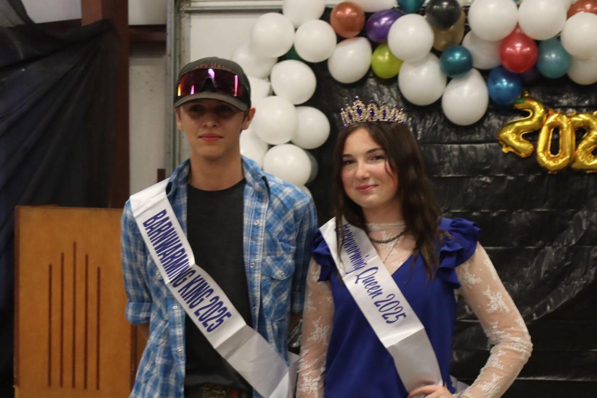 Sophomore Barnwarming king David Cobb and junior Barnwarming queen Bella Schwartz celebrate after being announced as the winners. “I am so greatful to be queen this year and I am very excited for this year’s FFA chapter and I can’t wait to see where this year takes me,” Schwartz said.