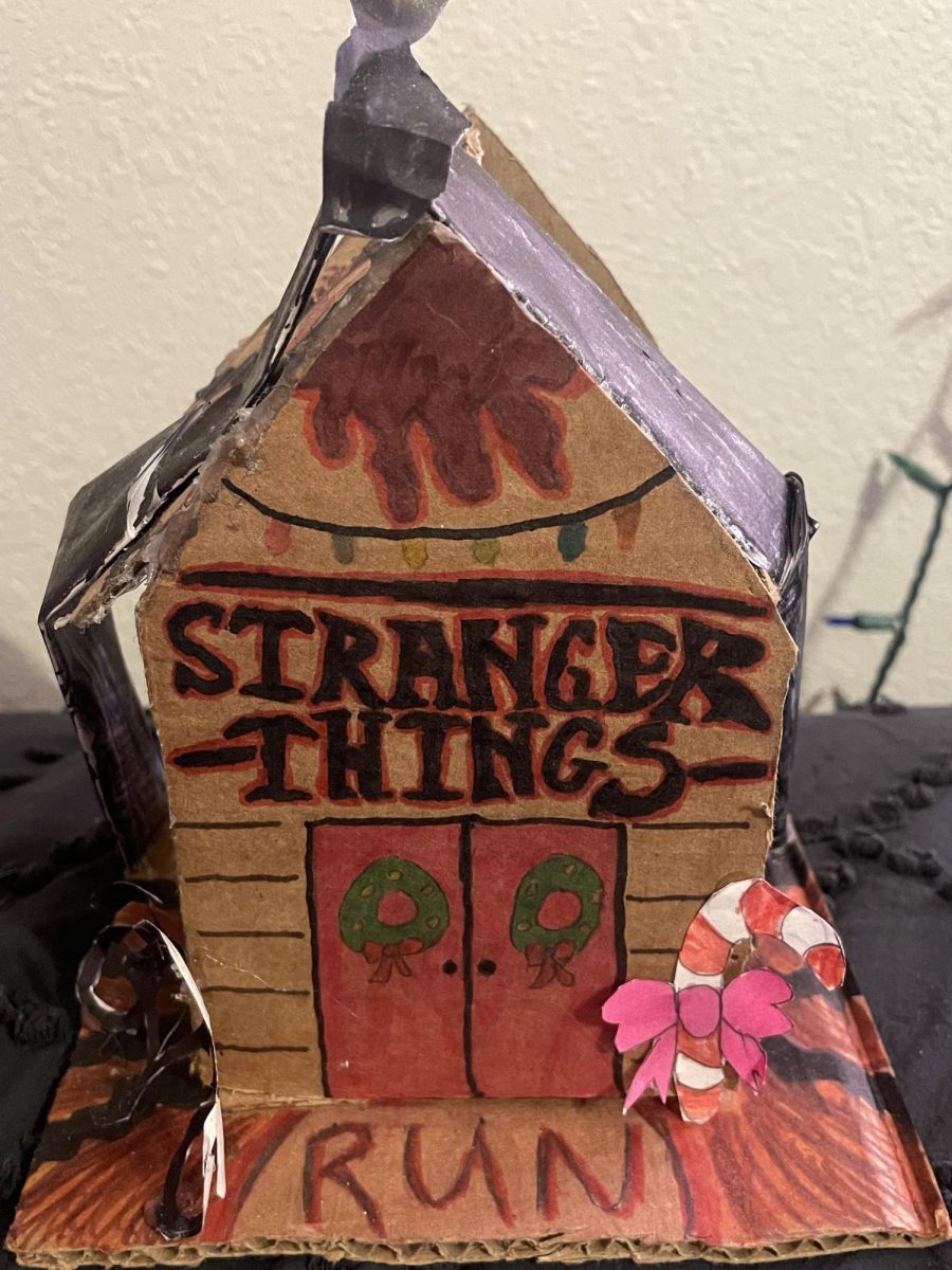 Senior Abbey Wilson made a cardboard Stranger Things themed gingerbread house for art class. The gingerbread house features designs on the bottom like the upside down ground and the mind flayer over the top of the house.