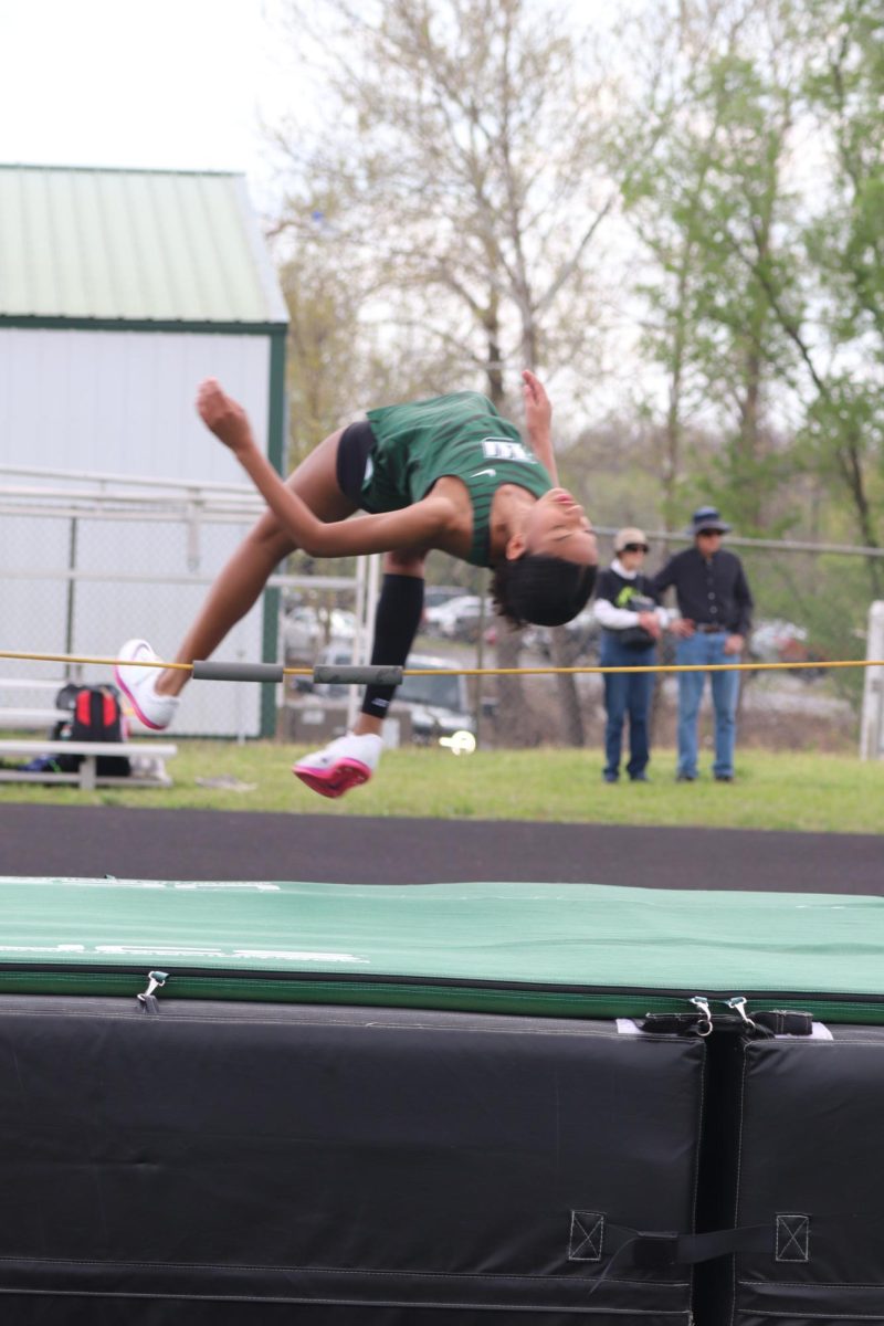 Sophomore Addison Hill competes in the high jump. She got first place at this competition.
