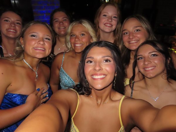 Juniors Sara Miller, Karly Keele, Jordan Dove, seniors Kaleby Stevenson, Hailey Ferguson, juniors Olivia Morrison, Elizabeth Winters, and sophomore Emmersyn Miskell pose for a selfie at prom on May 3. Ferguson won prom queen along with senior Josh Harvath. 